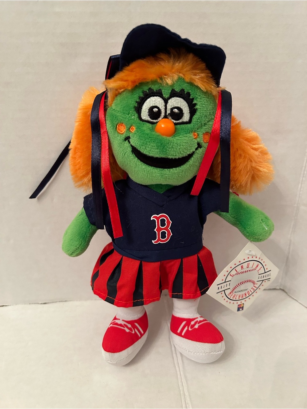 Genuine Merchandise Green Mascot Plush with Orange Hair and Navy Outfit